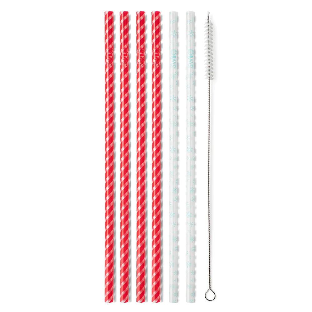 This is a pack of six straws with one cleaning brush, there are four red and  white straws, and 2 with white snowflakes. These items are taken on a white  background.