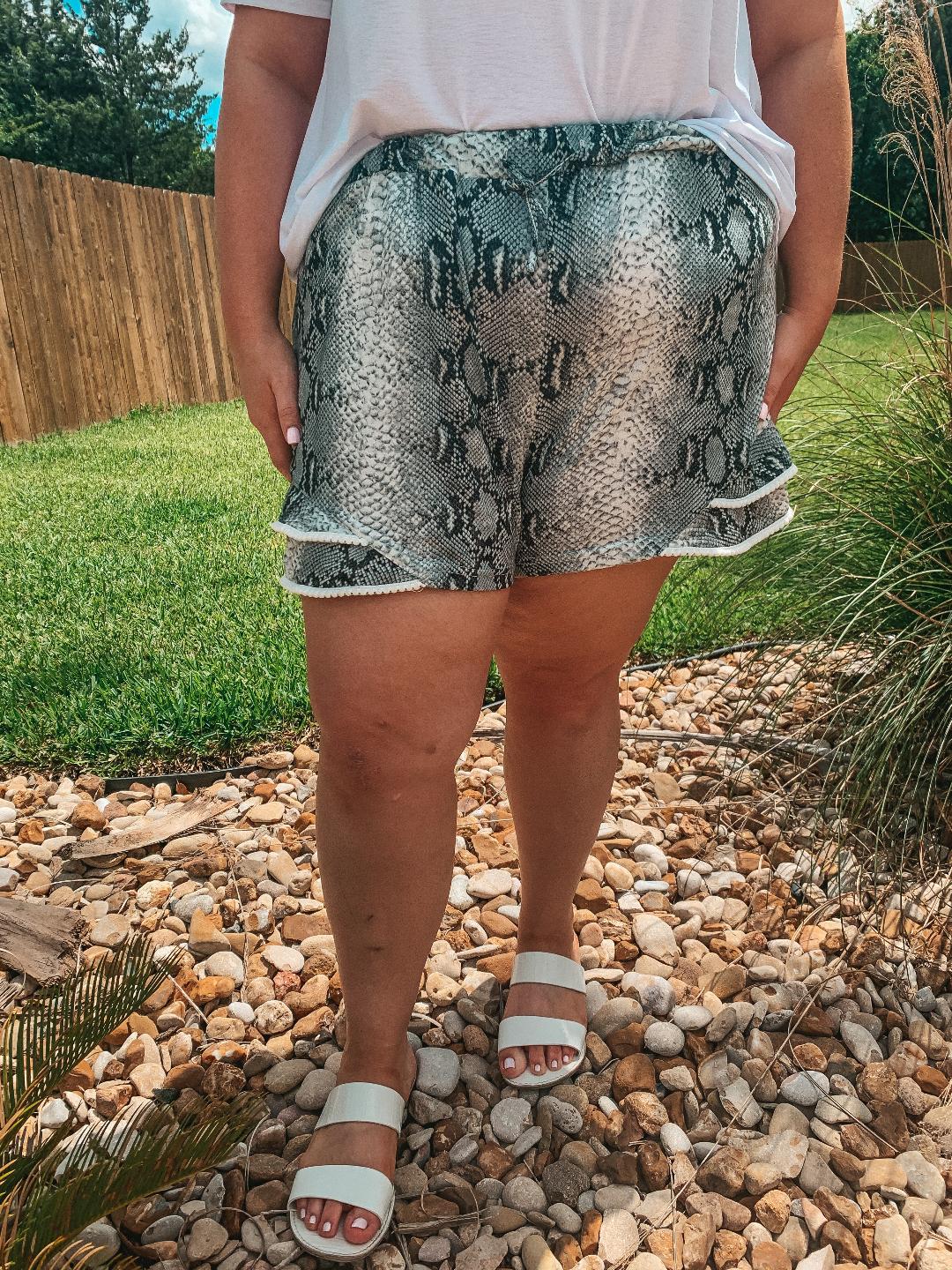 Making Hissstory Ruffle Hem Shorts with Pom Pom Trim in Snakeskin - Giddy Up Glamour Boutique
